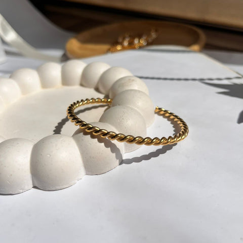 Thin twisted bangle