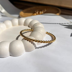 Thin twisted bangle